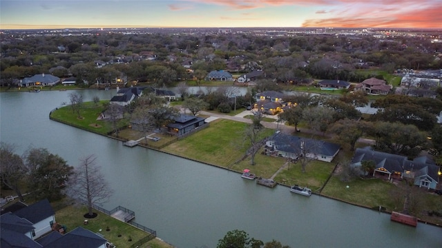 aerial view featuring a residential view and a water view