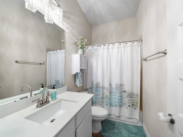 bathroom featuring vanity, shower / bath combination with curtain, and toilet