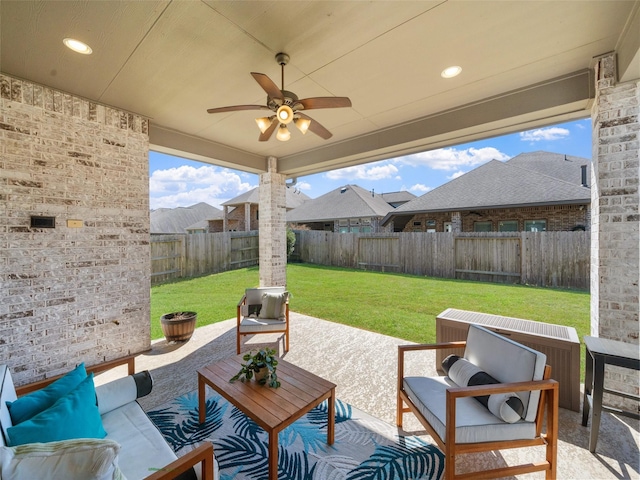 view of patio with ceiling fan, outdoor lounge area, and a fenced backyard