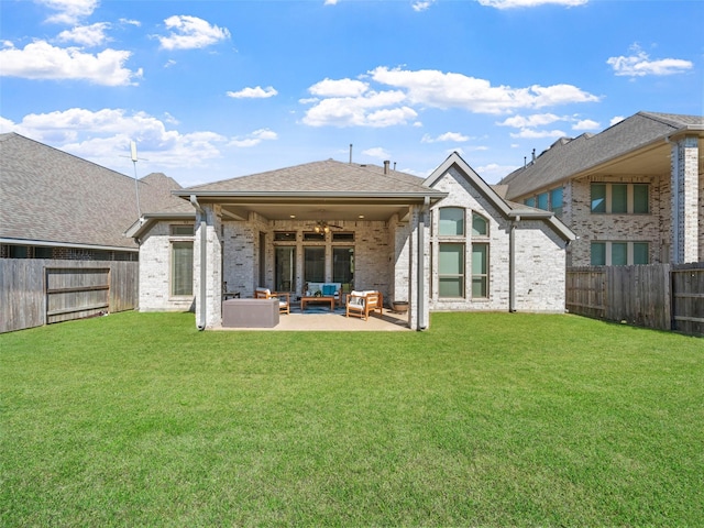 rear view of house featuring outdoor lounge area, a fenced backyard, ceiling fan, and a patio