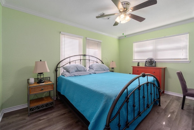 bedroom featuring wood finished floors, multiple windows, and ornamental molding