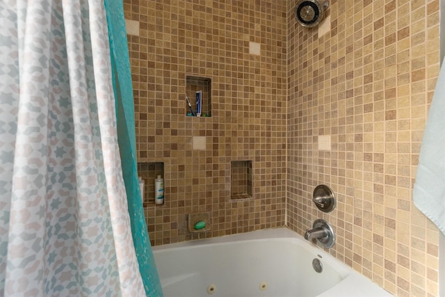 full bathroom featuring a combined bath / shower with jetted tub