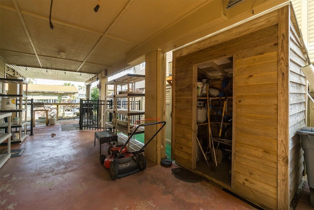 interior space featuring unfinished concrete flooring