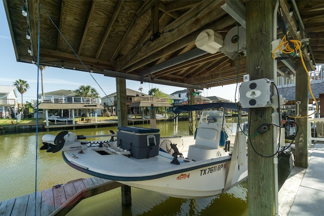 dock area featuring a water view and boat lift