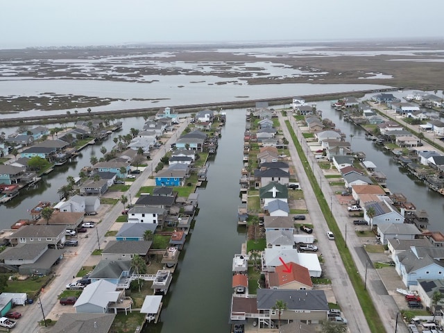 birds eye view of property with a residential view and a water view