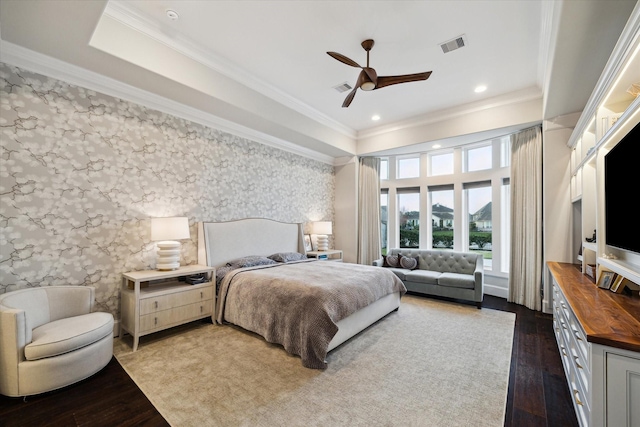 bedroom featuring visible vents, dark wood-style flooring, and crown molding