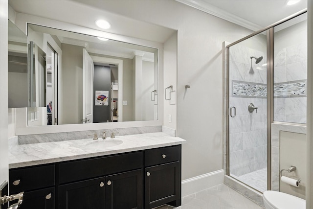 bathroom featuring crown molding, baseboards, toilet, a stall shower, and vanity