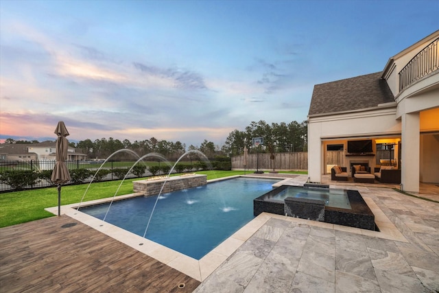 view of pool with a fenced in pool, a yard, an in ground hot tub, and a fenced backyard