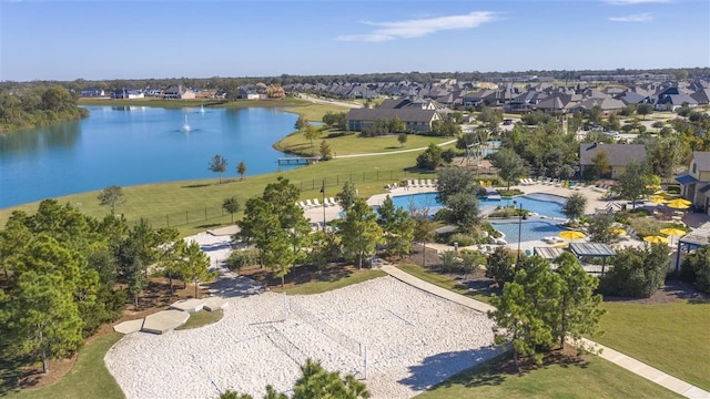 drone / aerial view featuring a residential view and a water view