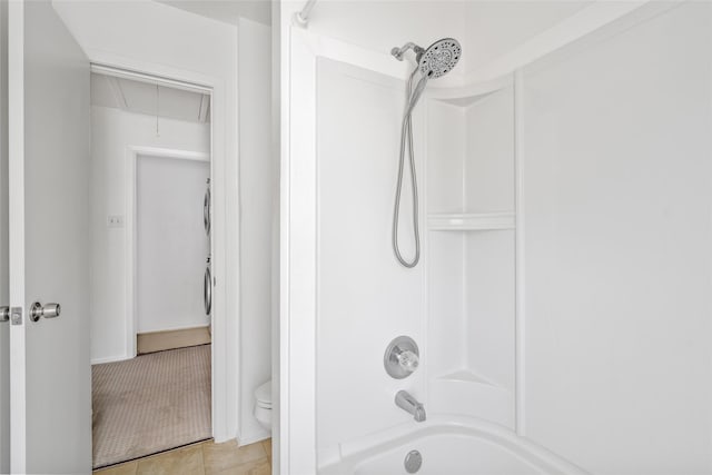 full bath featuring toilet, tile patterned flooring, and bathtub / shower combination