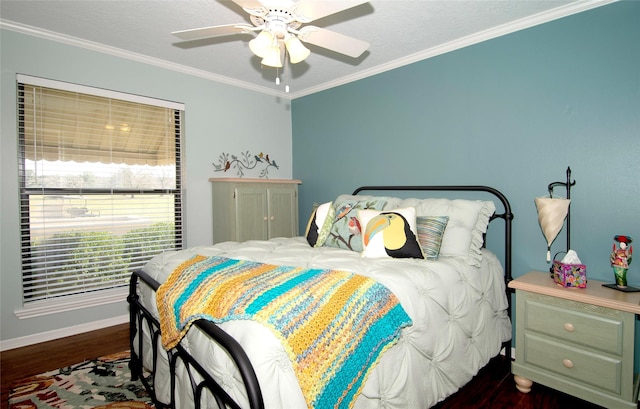 40 Driving Range Ln, Trinity, TX 75862 - bedroom with dark wood-style floors, ornamental molding, baseboards, and a ceiling fan