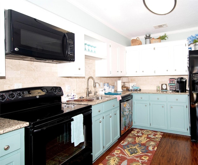 40 Driving Range Ln, Trinity, TX 75862 - kitchen with blue cabinets, black appliances, crown molding, and a sink