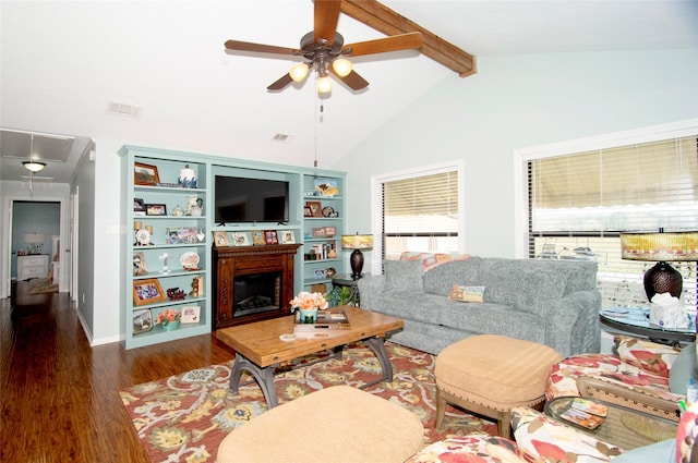 40 Driving Range Ln, Trinity, TX 75862 - living area with a fireplace, visible vents, attic access, wood finished floors, and beamed ceiling