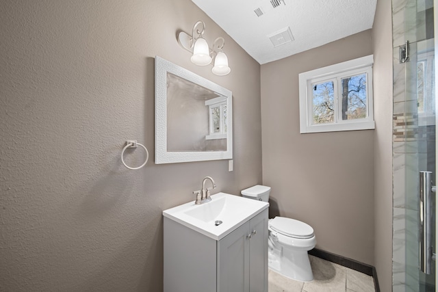 bathroom featuring a stall shower, visible vents, vanity, and toilet