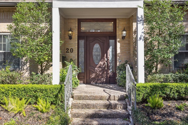 entrance to property with brick siding