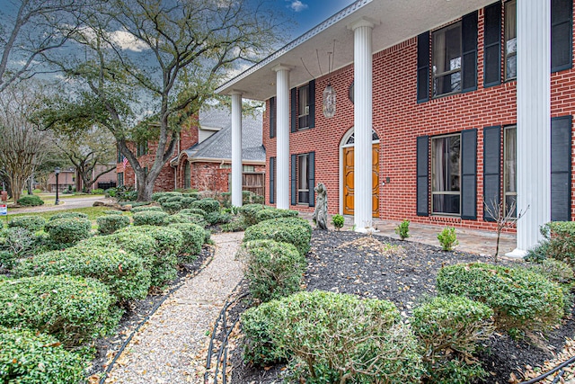 view of home's exterior featuring brick siding