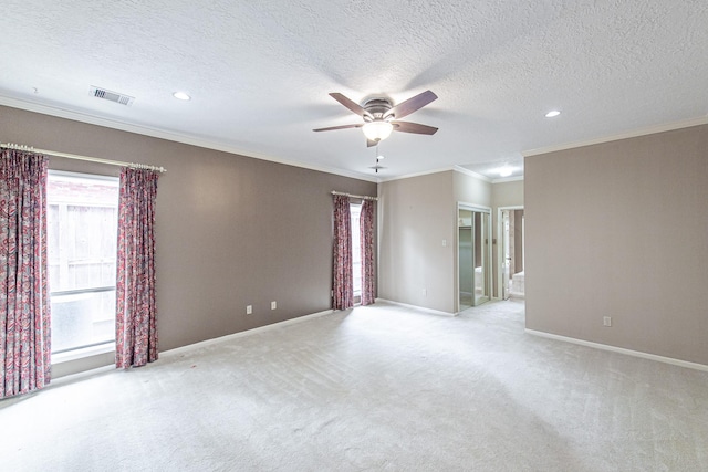 empty room featuring light carpet, crown molding, baseboards, and ceiling fan