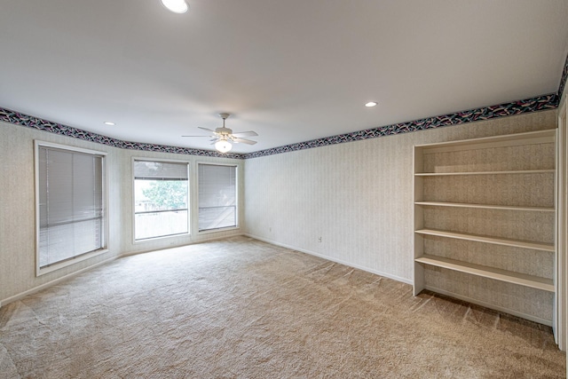 empty room featuring recessed lighting, a ceiling fan, carpet flooring, baseboards, and wallpapered walls