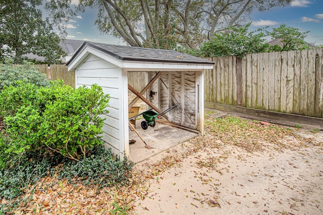 view of shed featuring a fenced backyard