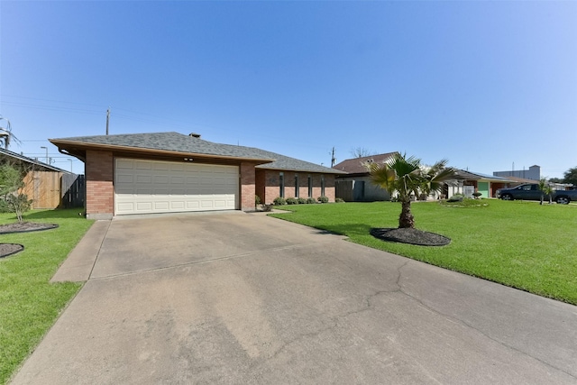 view of front of house with a garage, a front yard, brick siding, and driveway