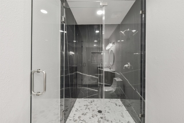 bathroom with a shower stall