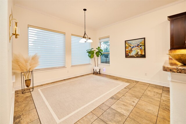 unfurnished dining area with light tile patterned floors, baseboards, and ornamental molding