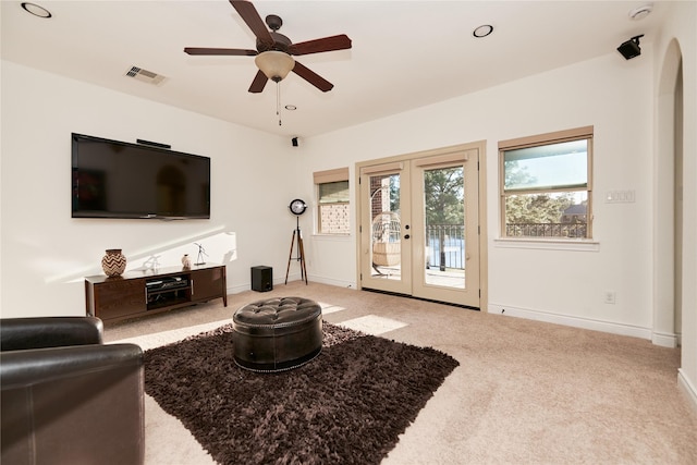 living room featuring visible vents, french doors, carpet flooring, baseboards, and ceiling fan