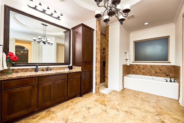 bathroom with vanity, crown molding, tiled shower, and a chandelier