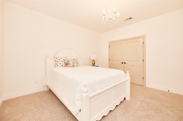 bedroom featuring light carpet, visible vents, and baseboards