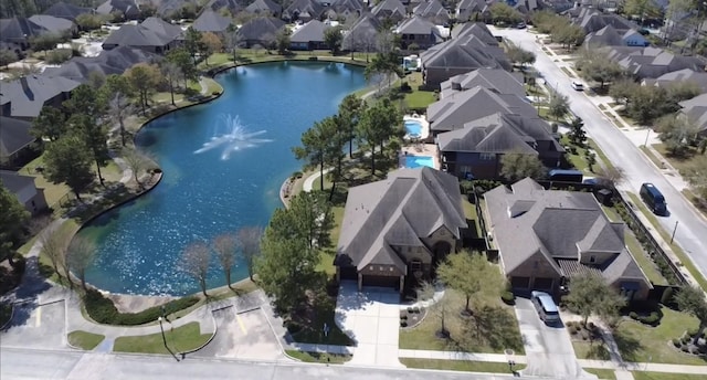 birds eye view of property featuring a residential view and a water view