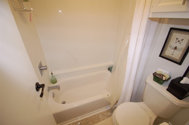 bathroom with toilet and tile patterned floors