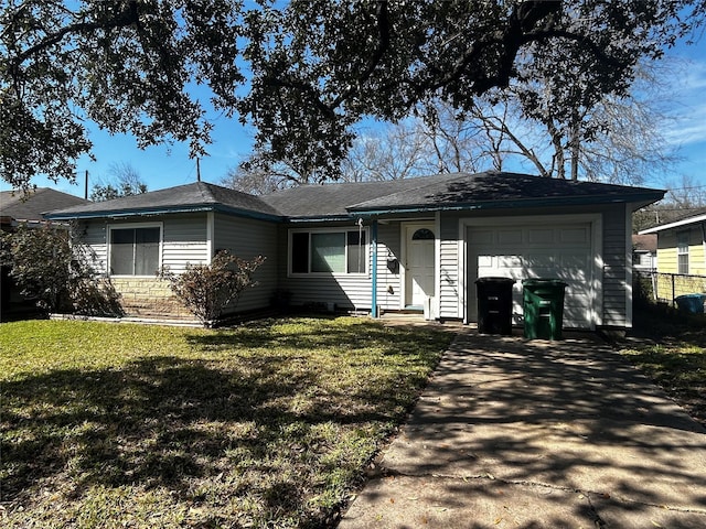 single story home with an attached garage, driveway, and a front yard