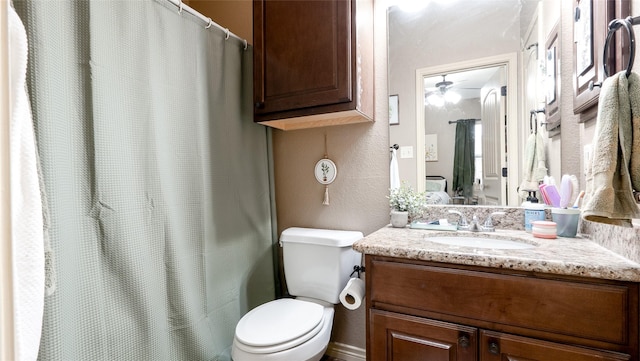 2903 Old Ironsides Dr, College Station, TX 77845 - bathroom with vanity, a ceiling fan, a textured wall, and a shower with curtain