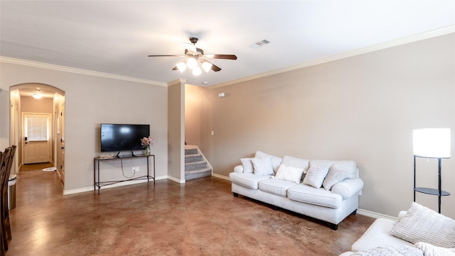 2903 Old Ironsides Dr, College Station, TX 77845 - living room with arched walkways, ceiling fan, concrete flooring, ornamental molding, and stairs