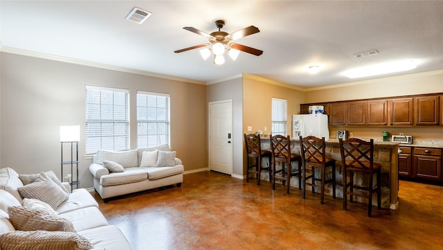 2903 Old Ironsides Dr, College Station, TX 77845 - kitchen with white fridge with ice dispenser, open floor plan, finished concrete flooring, a ceiling fan, and ornamental molding