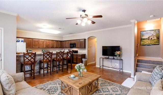 2903 Old Ironsides Dr, College Station, TX 77845 - living area featuring ceiling fan, arched walkways, ornamental molding, and stairway