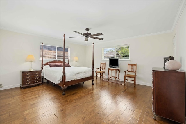 bedroom with baseboards, ornamental molding, ceiling fan, and dark wood-type flooring