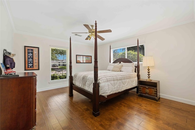 bedroom featuring ornamental molding, dark wood finished floors, and visible vents