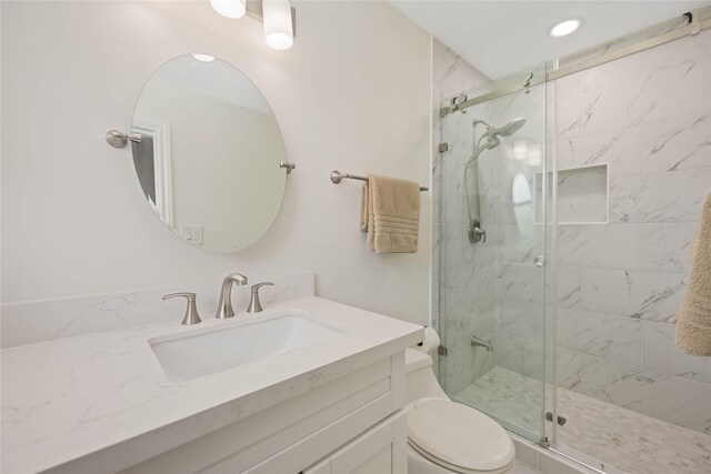 7719 Highmeadow Dr, Houston, TX 77063 - bathroom with toilet, vanity, a shower stall, and recessed lighting
