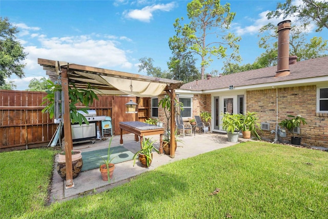 view of yard featuring a patio, fence, and a pergola