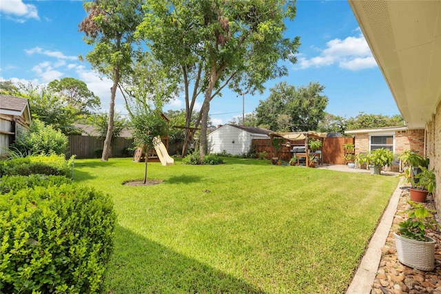 view of yard with a patio area and a fenced backyard