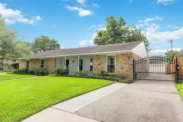 single story home featuring brick siding, a front lawn, fence, and a gate