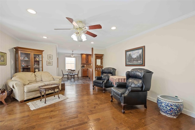 living room with baseboards, ornamental molding, hardwood / wood-style floors, and recessed lighting