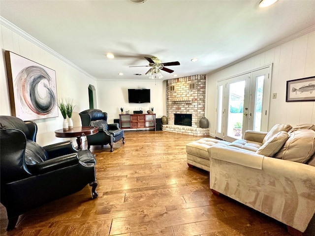 7719 Highmeadow Dr, Houston, TX 77063 - living area featuring recessed lighting, a fireplace, ceiling fan, ornamental molding, and hardwood / wood-style flooring