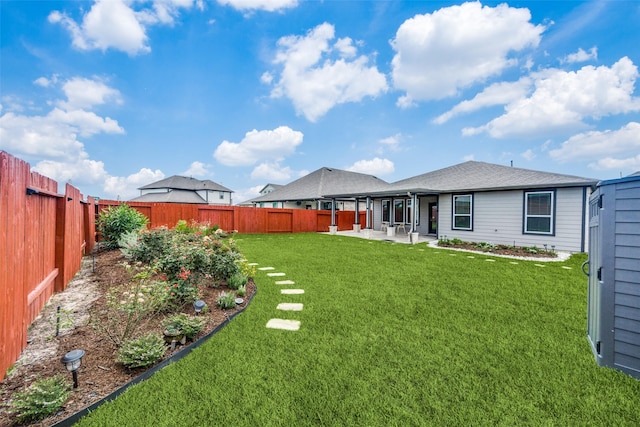 view of yard with a patio and a fenced backyard