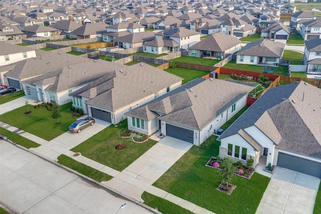 birds eye view of property with a residential view