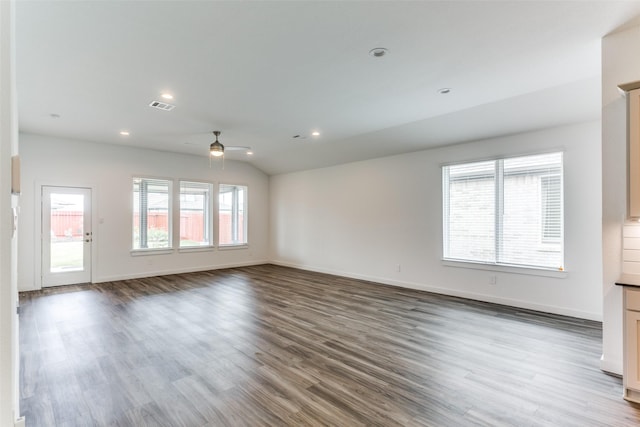 unfurnished room featuring lofted ceiling, visible vents, wood finished floors, and recessed lighting