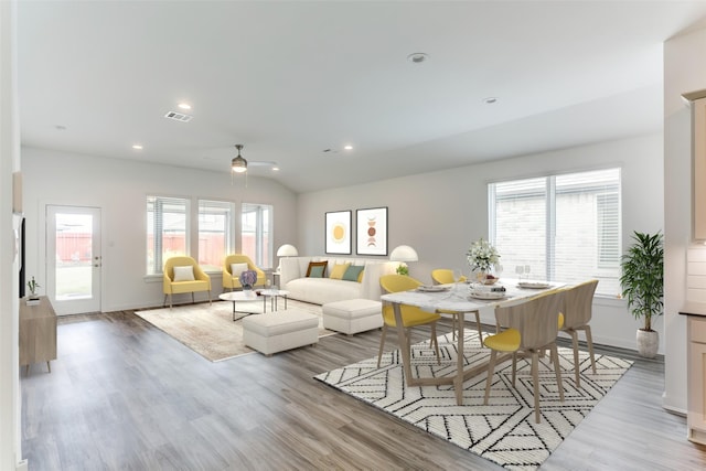 living room with visible vents, lofted ceiling, ceiling fan, wood finished floors, and recessed lighting