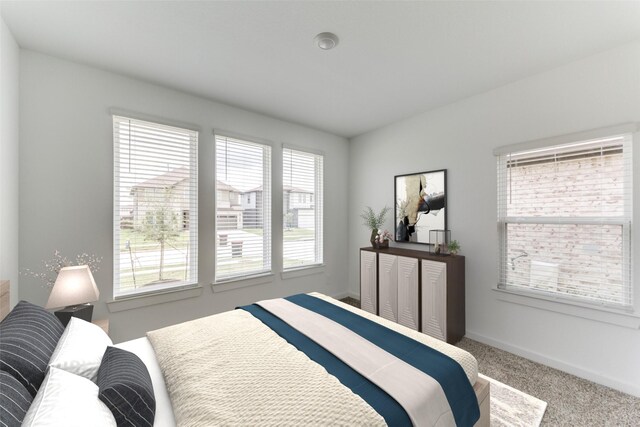 carpeted bedroom with baseboards