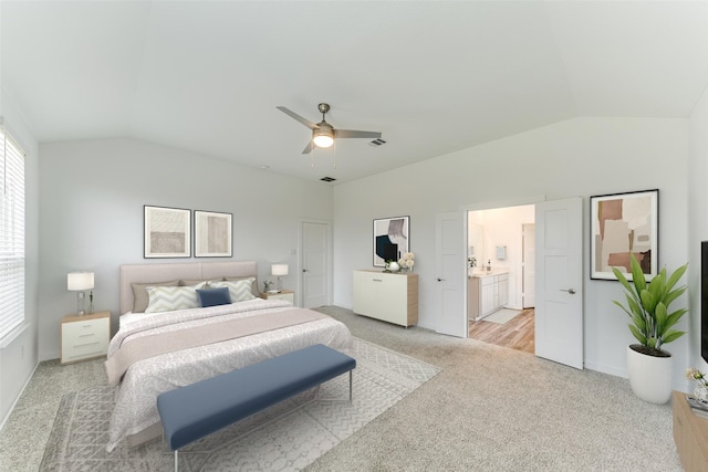 bedroom featuring a ceiling fan, light colored carpet, vaulted ceiling, and visible vents